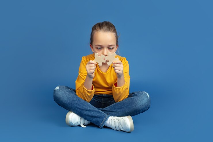 portrait sad little girl sitting isolated blue studio background how it feels be autist modern problems new vision social issues concept autism childhood healthcare medicine 155003 36538