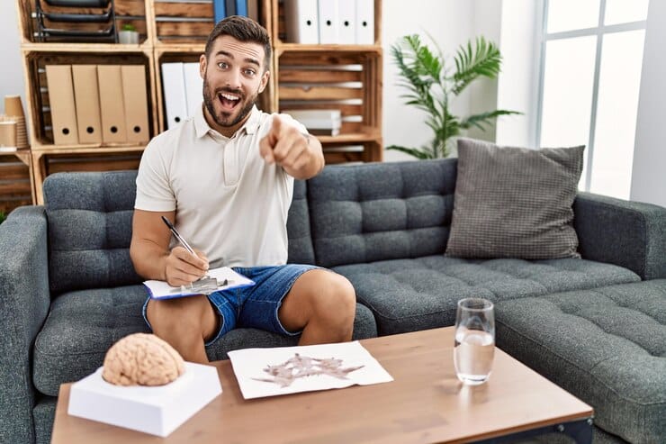 handsome hispanic man working with rorschach test psychology clinic pointing you camera with fingers smiling positive cheerful 839833 10612